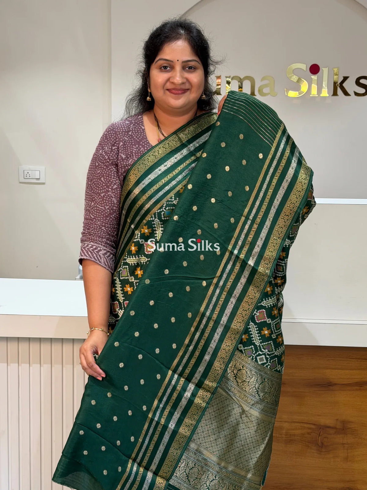 Moonga Crepe Navratan Patola Saree Bottle Green Color