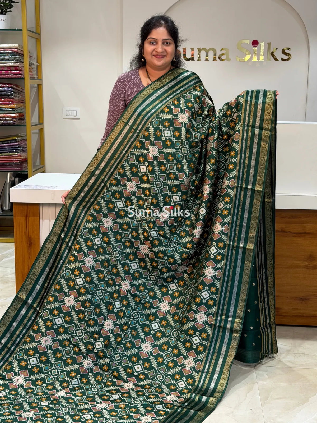 Moonga Crepe Navratan Patola Saree Bottle Green Color