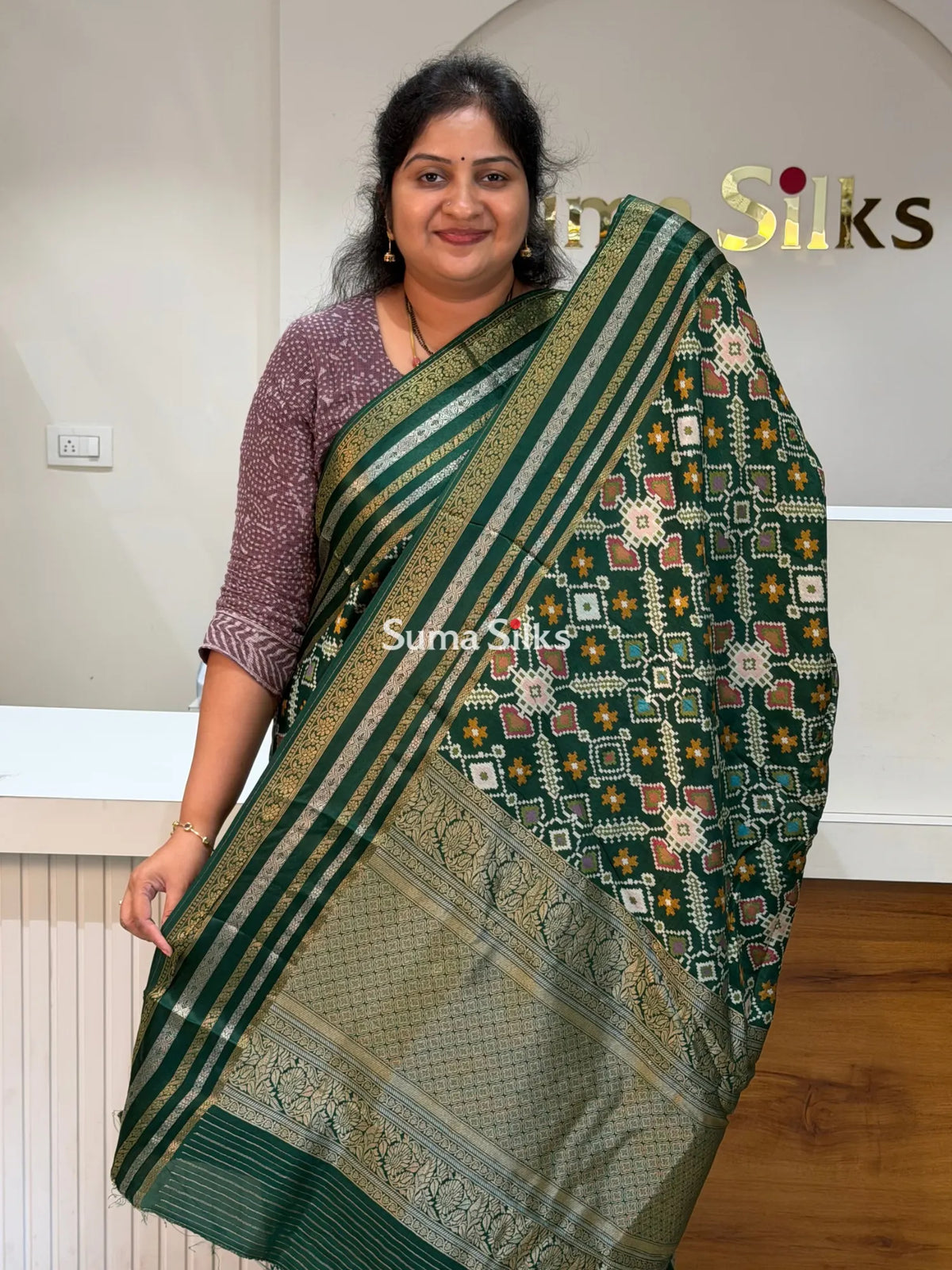 Moonga Crepe Navratan Patola Saree Bottle Green Color