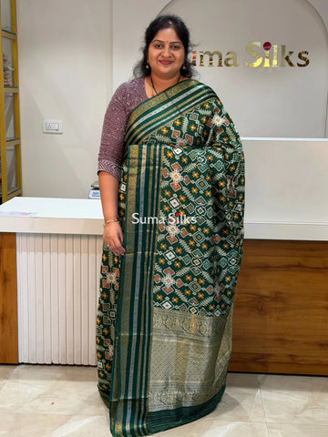 Moonga Crepe Navratan Patola Saree Bottle Green Color