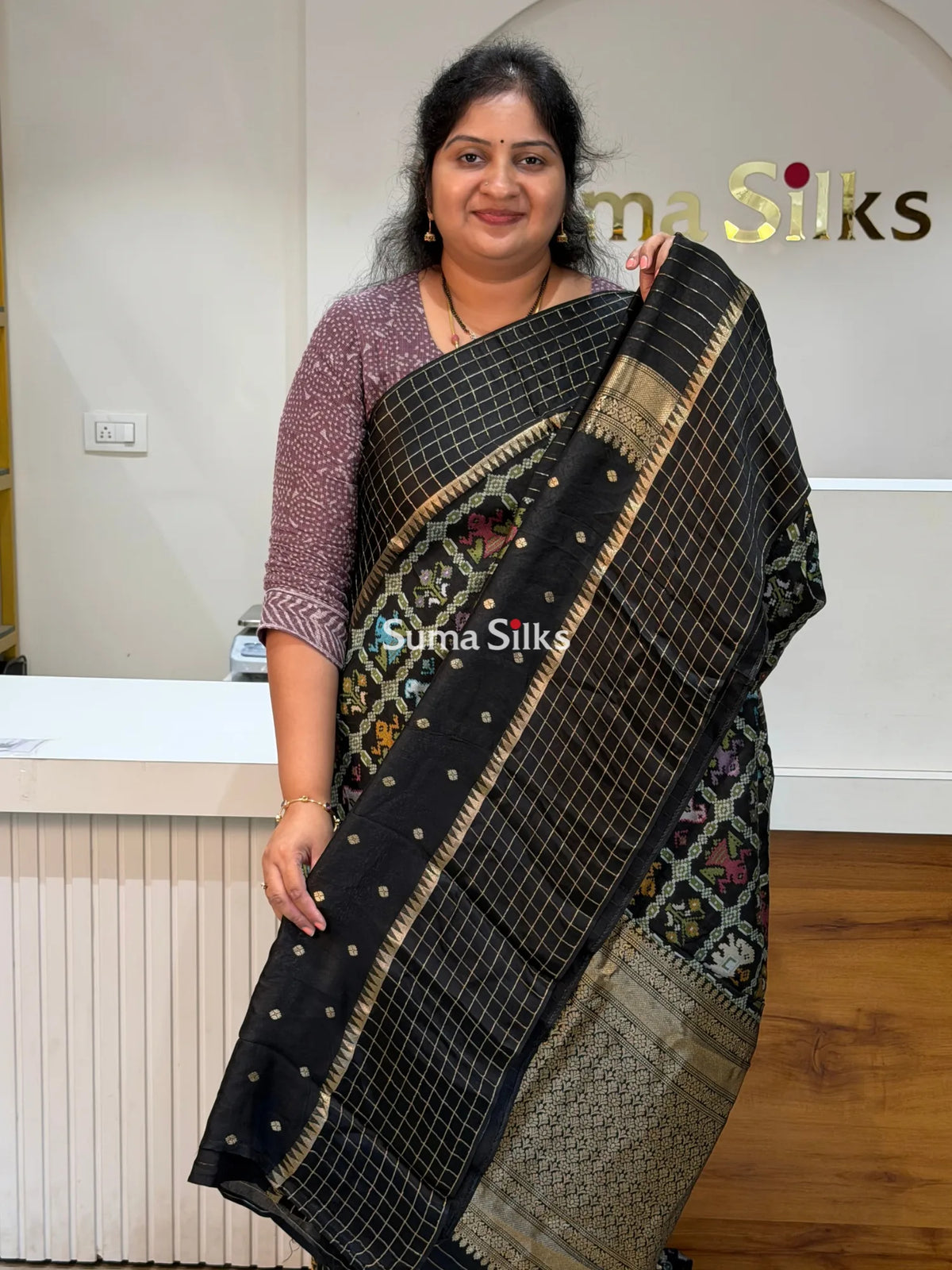 Moonga Crepe Patola Checks Border Saree Black Color