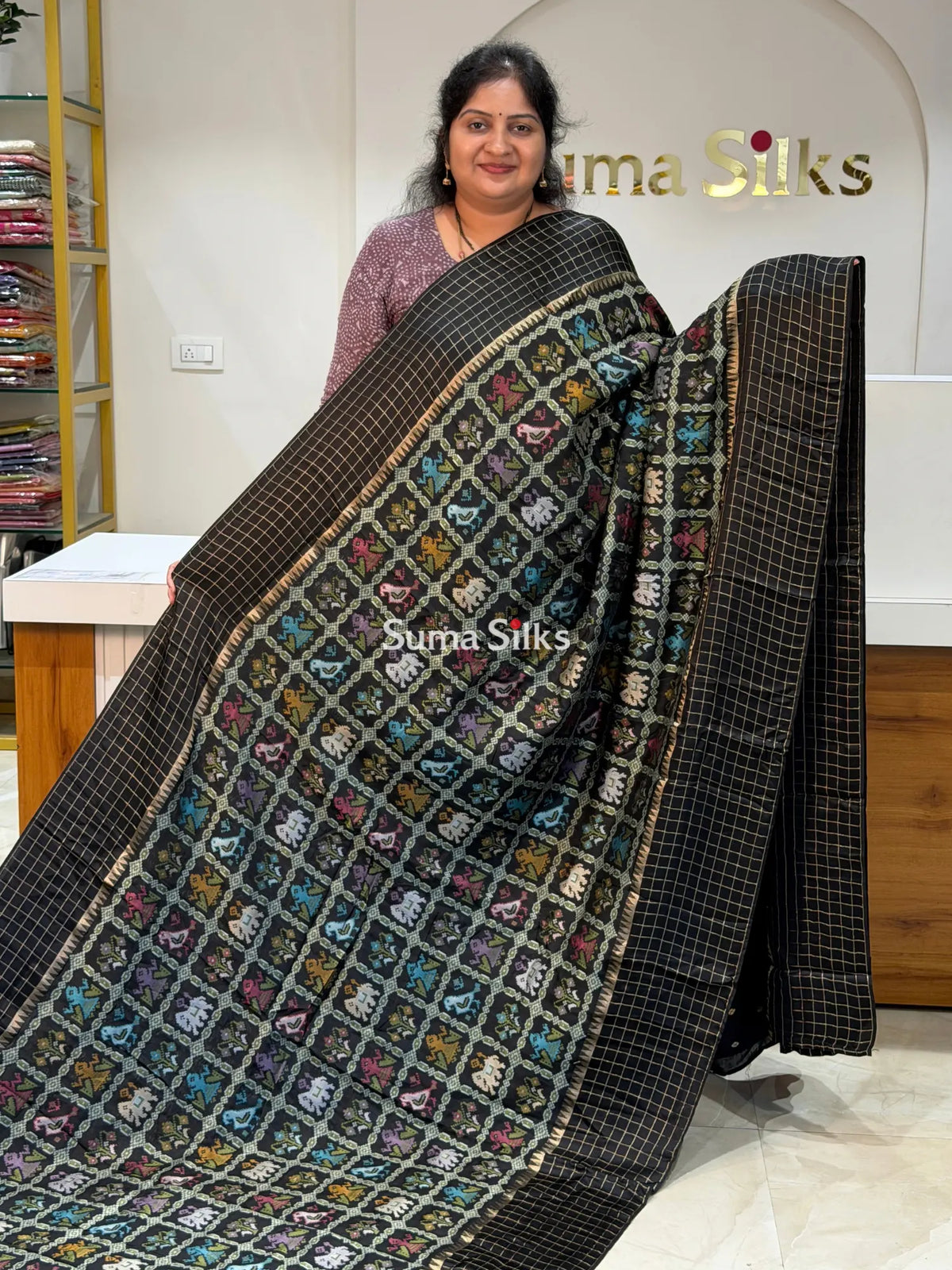 Moonga Crepe Patola Checks Border Saree Black Color