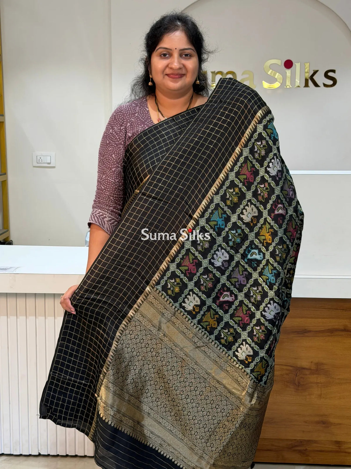 Moonga Crepe Patola Checks Border Saree Black Color