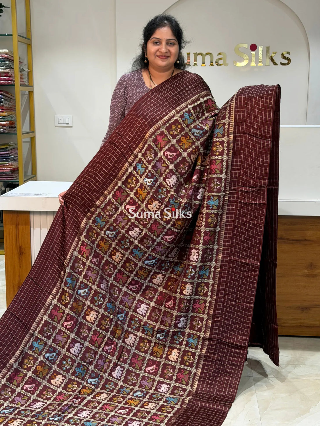Moonga Crepe Patola Checks Border Saree Brown Color