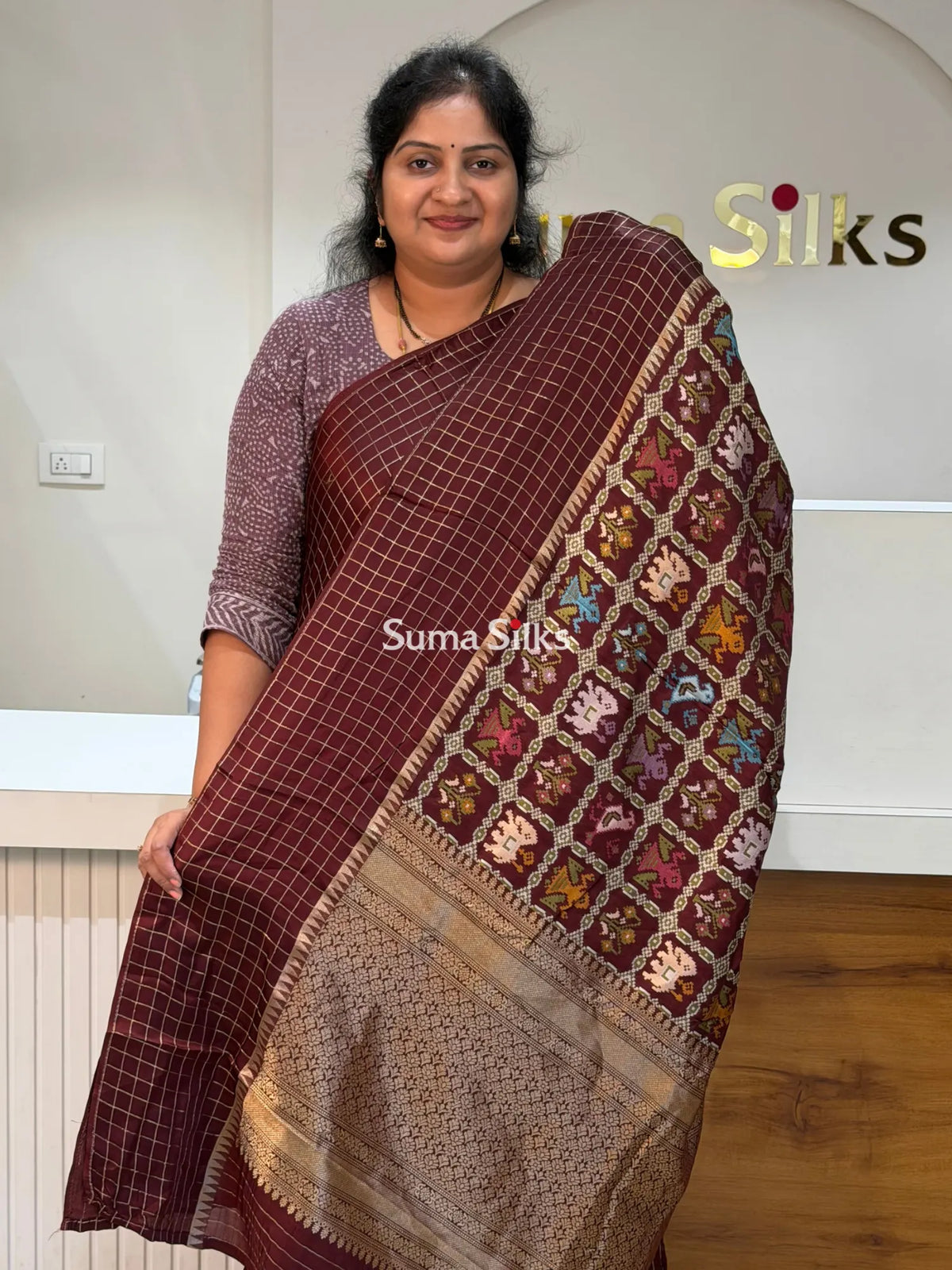 Moonga Crepe Patola Checks Border Saree Brown Color