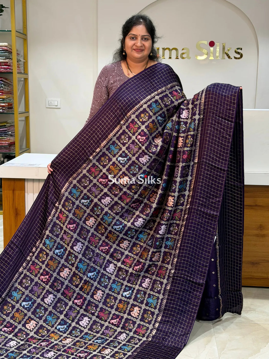 Moonga Crepe Patola Checks Border Saree Purple Color