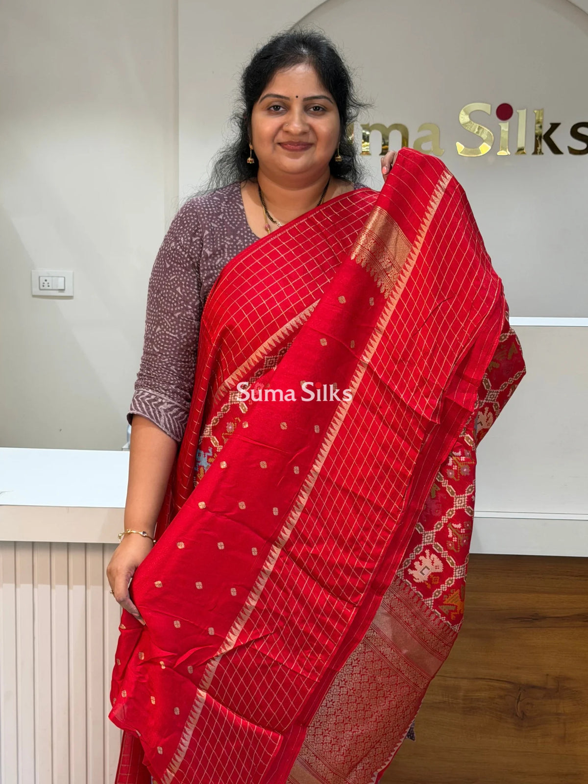 Moonga Crepe Patola Checks Border Saree Red Color