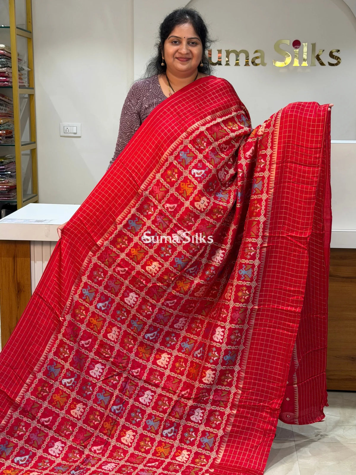 Moonga Crepe Patola Checks Border Saree Red Color