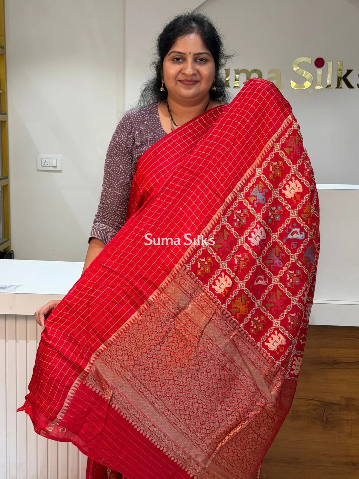 Moonga Crepe Patola Checks Border Saree Red Color
