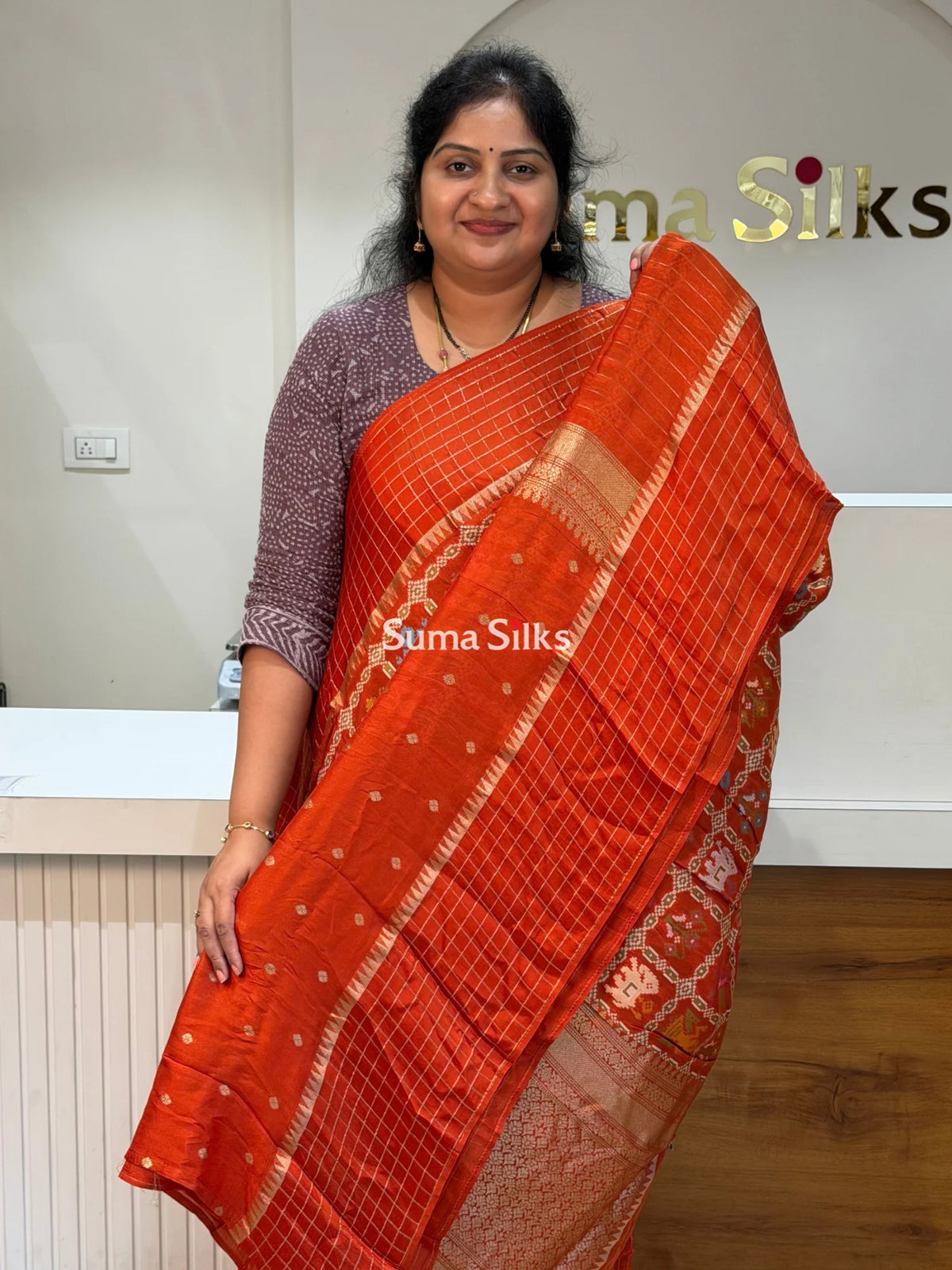 Moonga Crepe Patola Checks Border Saree Rust Color
