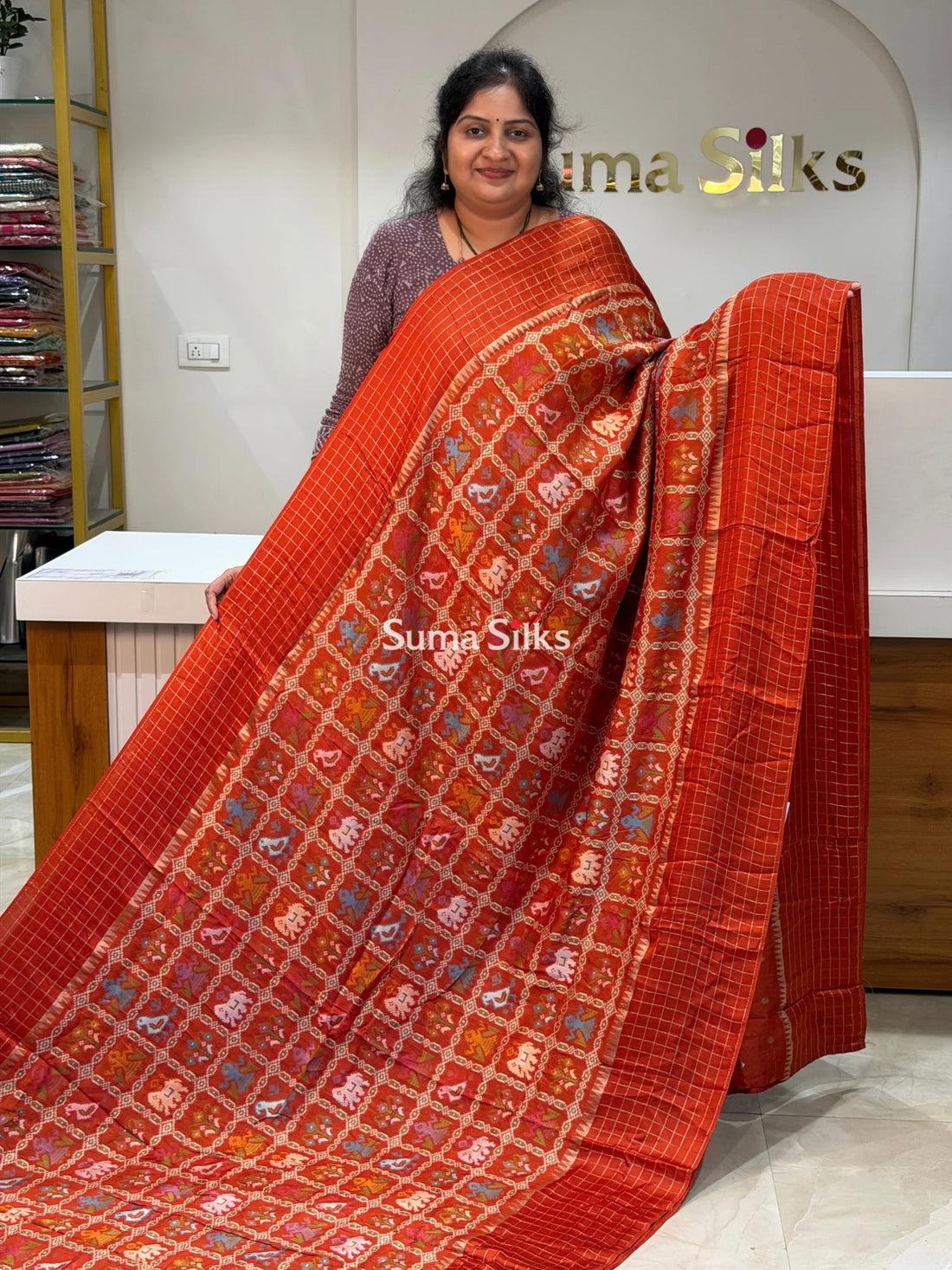 Moonga Crepe Patola Checks Border Saree Rust Color