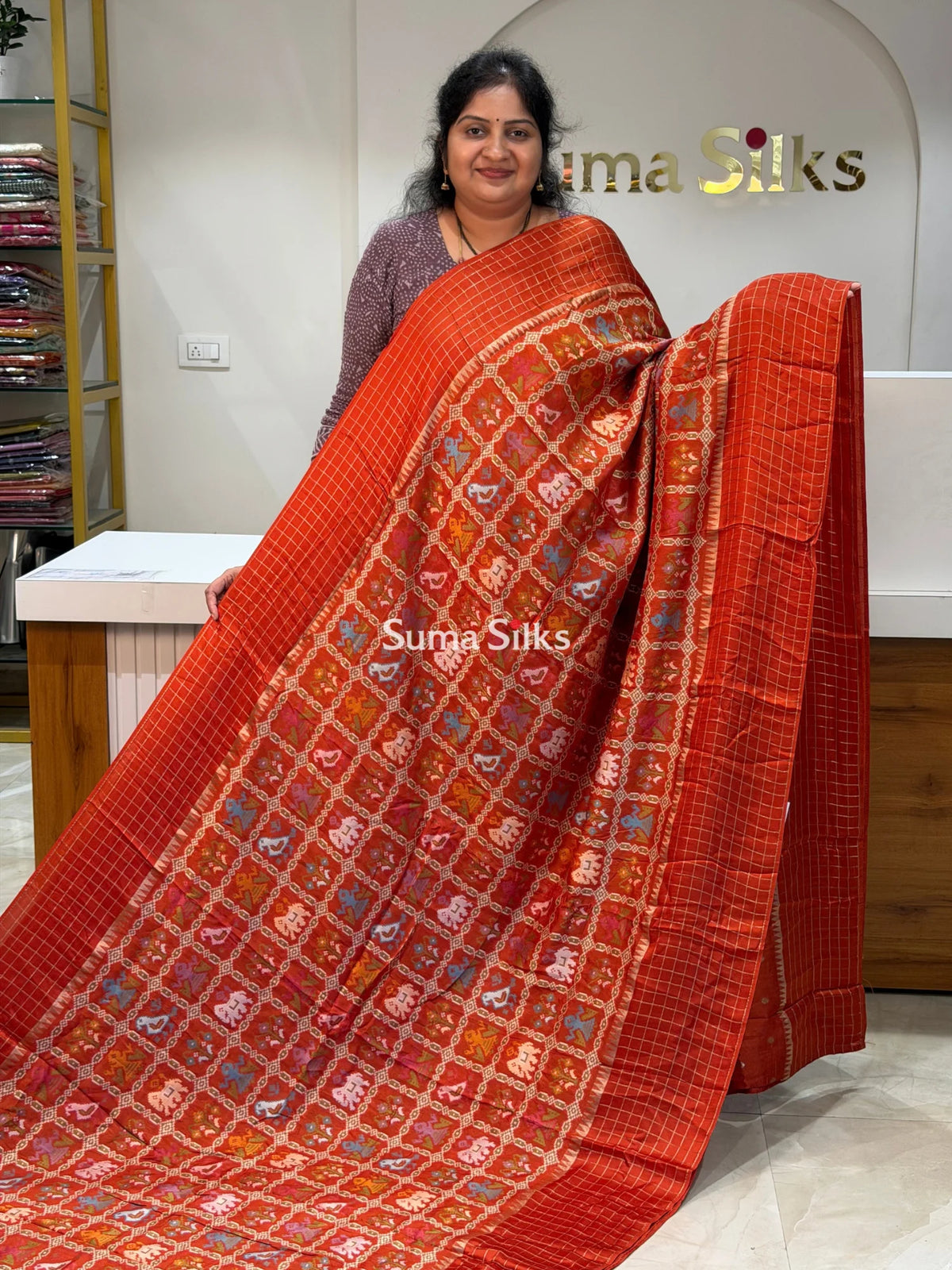 Moonga Crepe Patola Checks Border Saree Rust Color