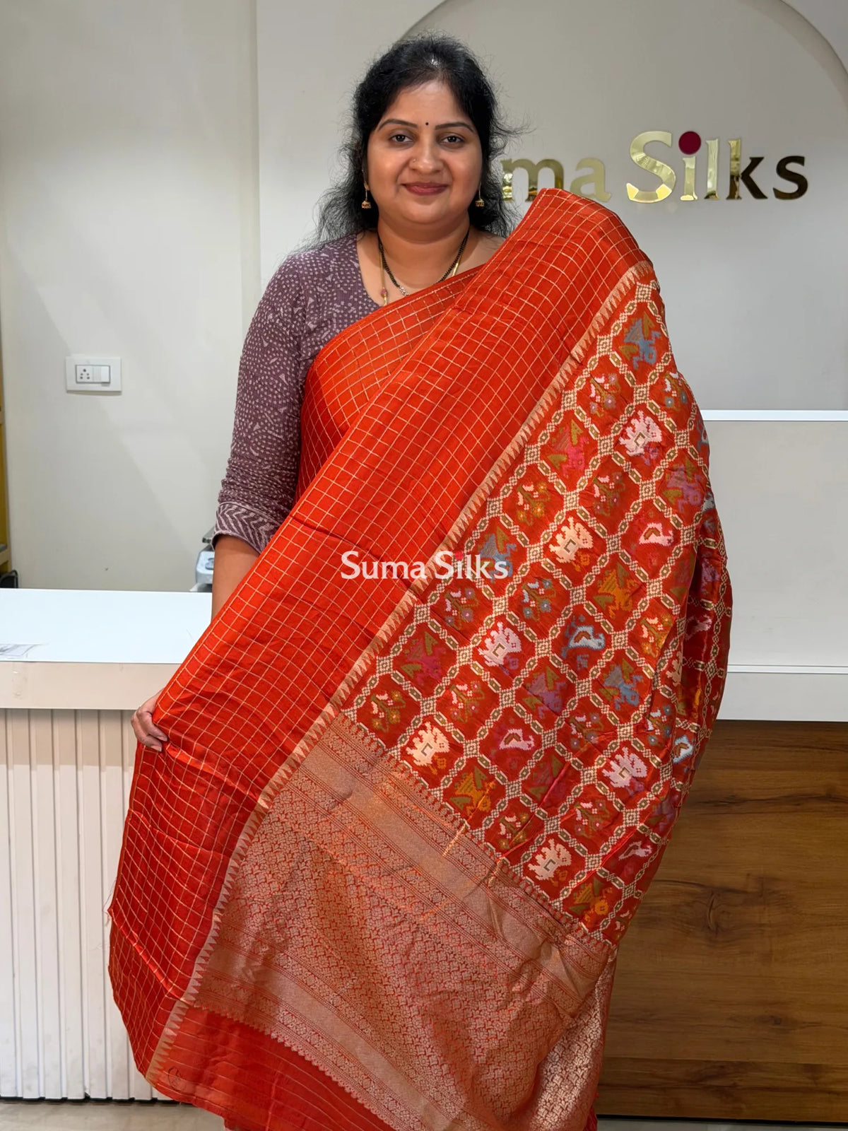 Moonga Crepe Patola Checks Border Saree Rust Color