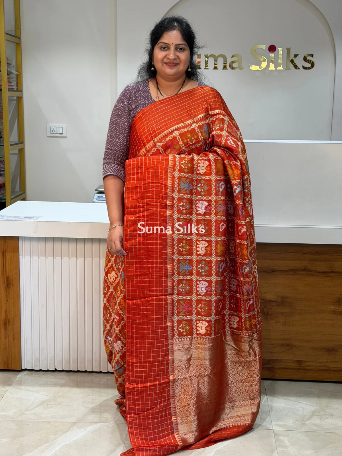 Moonga Crepe Patola Checks Border Saree Rust Color